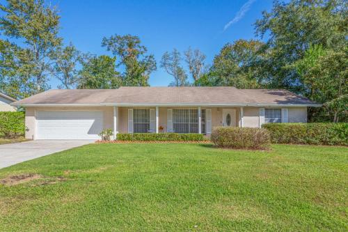 a white house with a lawn in front of it at Rainey 5577 in Orange Park