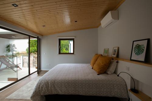 Ένα ή περισσότερα κρεβάτια σε δωμάτιο στο Eco Villa do Adro