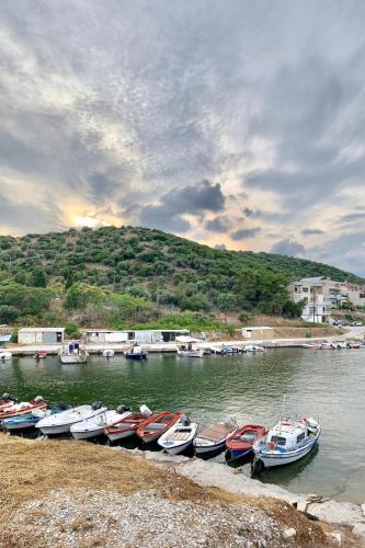 a bunch of boats are lined up in the water at Dimitra Beach Apartments - Nea Karvali Kavala in Néa Karváli