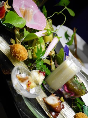 a plate of food with a salad on it at Yufuin Bettei Itsuki in Yufuin