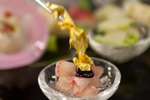 a small glass dish with food on top of it at Yufuin Bettei Itsuki in Yufuin