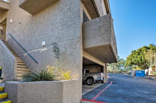 a building with a car parked in a parking lot at 4 Mi to ASU Lake-View Tempe Condo with Pool Access in Tempe