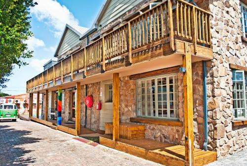 a building with a deck on the side of it at Funky Town in Jeffreys Bay