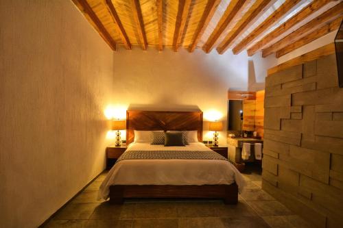 מיטה או מיטות בחדר ב-Hotel Casa Iturbe