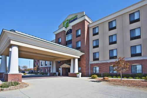 a hotel building with a sign on the front of it at Holiday Inn Express Hotel & Suites Anderson by IHG in Anderson