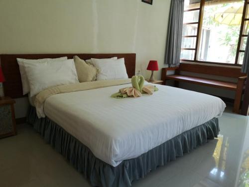Una cama o camas en una habitación de Alba Tulamben