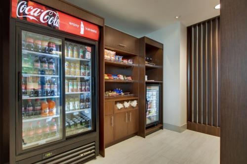a cocacola soda refrigerator in a store at Holiday Inn Express & Suites - Elizabethtown North by IHG in Elizabethtown
