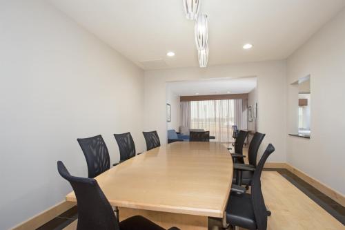 a conference room with a wooden table and chairs at Holiday Inn Express & Suites Amarillo by IHG in Amarillo