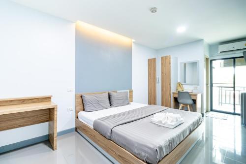 Giường trong phòng chung tại Be Wish Residence