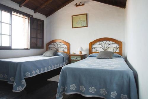 Tesbabo Rural 객실 침대