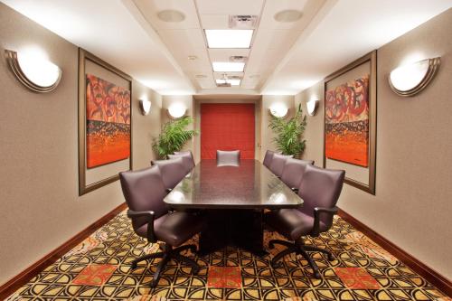 a conference room with a table and chairs at Holiday Inn Express Hotel & Suites Atlanta-Cumming by IHG in Cumming