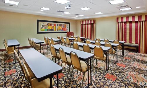 a classroom with tables and chairs in a room at Holiday Inn Express Hotel & Suites Atlanta-Cumming by IHG in Cumming