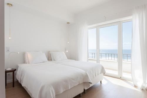 Giường trong phòng chung tại Blue Buddha Beach Rooms & Suites