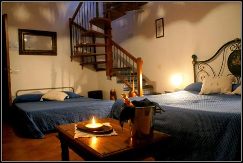 Un pat sau paturi într-o cameră la Pedra Residence