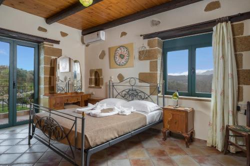 Voodi või voodid majutusasutuse Athina Traditional Villa toas