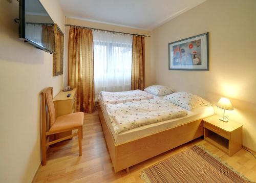 Cama o camas de una habitación en Gościniec Nad Potokiem