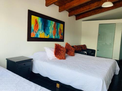 Ein Bett oder Betten in einem Zimmer der Unterkunft Hotel Lleras Premium #1