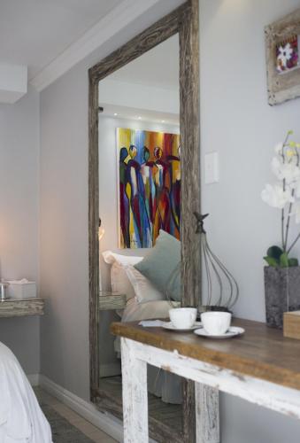 Ένα ή περισσότερα κρεβάτια σε δωμάτιο στο Luxury Upmarket Guesthouse 20 on 4th