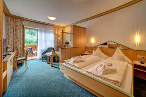 Postel nebo postele na pokoji v ubytování Wellness- und Wohlfühlhotel Waldeck