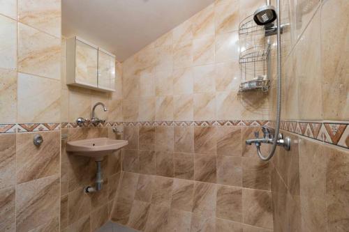 a bathroom with a sink and a shower at The Perfect One-Bedroom Maisonette in Plovdiv in Plovdiv