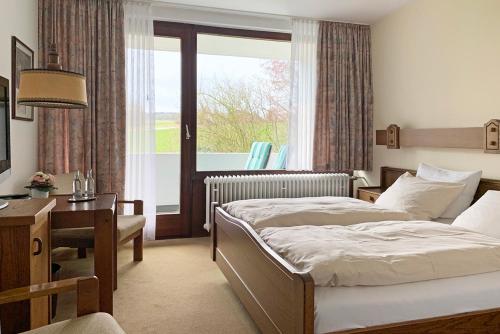 Katil atau katil-katil dalam bilik di Hotel Haus Eggewald