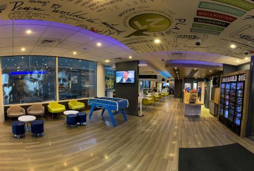 a store with a pool table in the middle of a room at ibis budget Belfast City Centre in Belfast