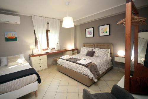 Posteľ alebo postele v izbe v ubytovaní B&B Capuam Vetere Accommodation