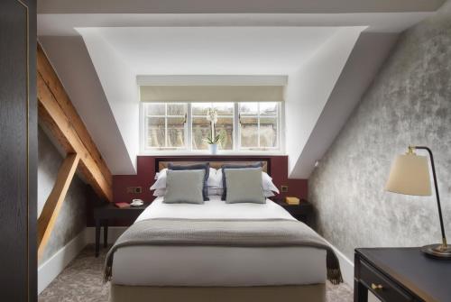 a bedroom with a bed and a window at Ensana Buxton Crescent in Buxton