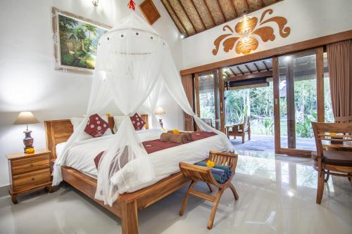 Ένα ή περισσότερα κρεβάτια σε δωμάτιο στο Jero Sebali Villa