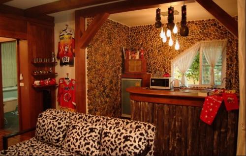 a living room with a cheetah print wall at Lamduan Boutique Homestay in Chiang Mai