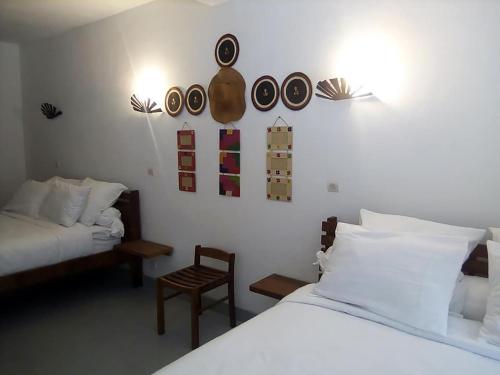 Postel nebo postele na pokoji v ubytování SATRANA HOTEL TAMATAVE