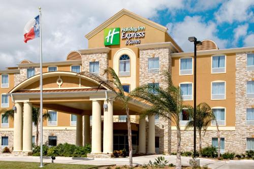a front view of a hotel with the hilton towers sign at Holiday Inn Express & Suites Corpus Christi by IHG in Corpus Christi
