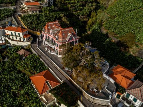 an overhead view of a large house with red roofs at 1905 Zino's Palace in Ponta do Sol