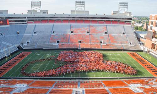 an image of a group of people on a football field at Holiday Inn Express & Suites Stillwater - University Area by IHG in Stillwater