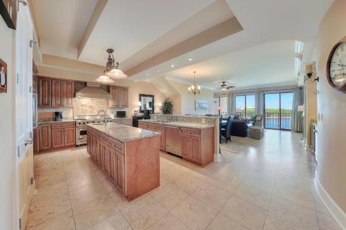 a large kitchen with a large island in a room at Sanctuary by the Sea Condos in Santa Rosa Beach
