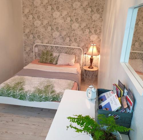 Llit o llits en una habitació de Light, cozy apartement