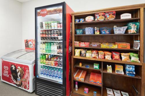 a refrigerator filled with lots of drinks and food at Holiday Inn Express Hotel & Suites Port Richey by IHG in Port Richey