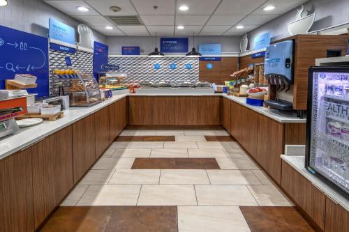 a grocery store aisle with a cash counter in a store at Holiday Inn Express & Suites Crossville by IHG in Crossville