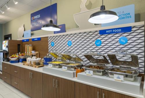 a food counter in a store with food on display at Holiday Inn Express & Suites - San Marcos South by IHG in San Marcos