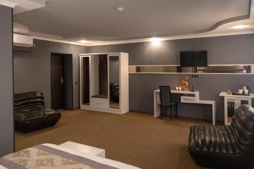 a living room with a couch and a table at Georgia Gold in Gori