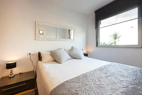 Кровать или кровати в номере CCIB Forum Deluxe Apartment