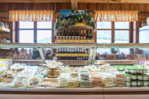 a display case in a store with food and drinks at Salaš Syrex in Zázrivá