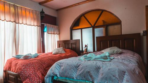Кровать или кровати в номере Hostal La Magia de Uyuni