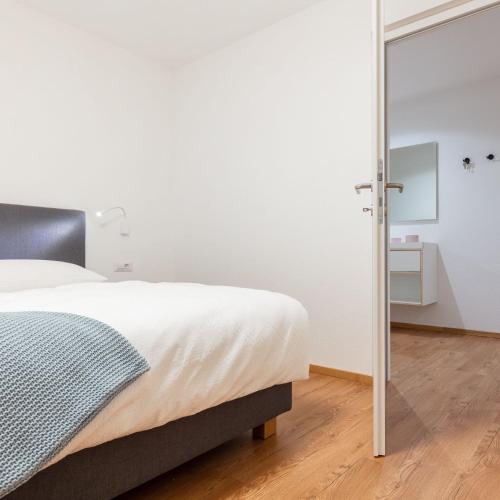 Ένα ή περισσότερα κρεβάτια σε δωμάτιο στο Hus Appartement - Nr. 5