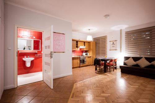 a living room with a kitchen and a dining room at RR15 - at the Old Market Square-RYNEK up to 8 pers in Wrocław