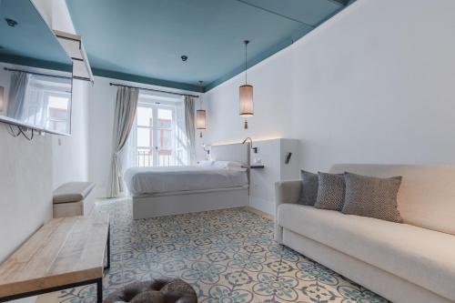 Posteľ alebo postele v izbe v ubytovaní Apartamentos Caminante del Agua