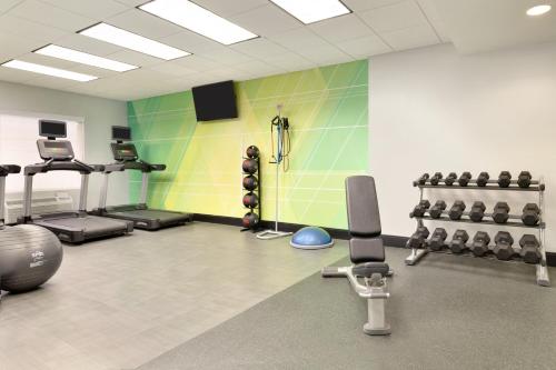 a fitness room with a gym with weights at Holiday Inn Houston Intercontinental Airport, an IHG Hotel in Houston