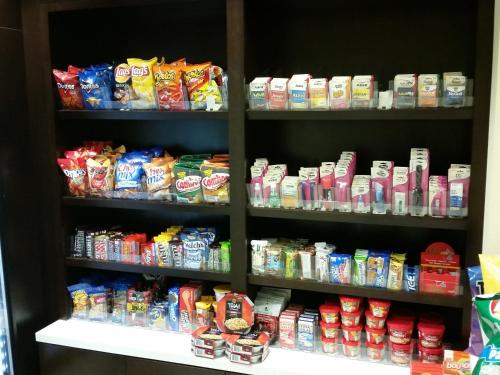 a store shelf filled with lots of different types of food at Holiday Inn Express and Suites Atascocita - Humble - Kingwood by IHG in Humble