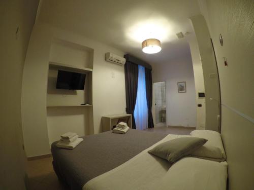 Postel nebo postele na pokoji v ubytování San Marco Hotel