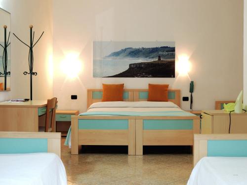 Postel nebo postele na pokoji v ubytování Hotel Porto Badisco